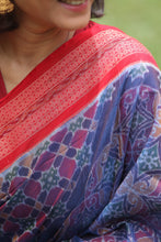 Load image into Gallery viewer, Close-up of red rudraksh border detailing on premium blue Sambalpuri cotton saree