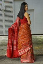 Load image into Gallery viewer, Sambalpuri Ikat border showcasing fish motifs alongside lion and elephant patterns in Burnt Orange cotton saree