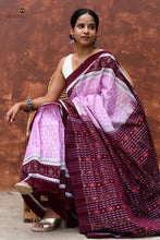 Load image into Gallery viewer, Border flower motif close-up on Annapurna Sambalpuri Bandha saree — resist-dyed ikat in deep maroon and pink, Pasapali Odisha.