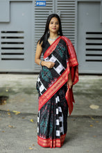 Load image into Gallery viewer, Detailed white and black Pasapali ikat stripes with tiny Bomkai motifs on a black cotton saree.