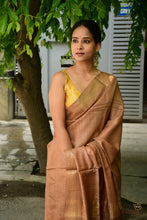 Load image into Gallery viewer, Texture close-up of light brown tussar silk Sambalpuri saree by Pasapali showing natural grain and double ikat Bandhakala weave