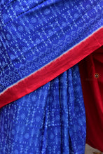Load image into Gallery viewer, Flat lay of Devyani Sambalpuri cotton saree — blue mercerized cotton with tribal body and ikat flower pallu, Pasapali