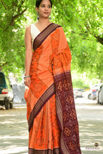 Load image into Gallery viewer, Front drape of orange Sambalpuri Bandha handloom saree from Pasapali showing Phula flower motif across the body.