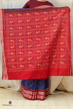 Load image into Gallery viewer, Drape front of Kaumudi GI certified Sambalpuri Bandha saree in mercerized cotton — chevron ikat body in deep blue