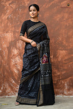 Load image into Gallery viewer, Flat lay of Krishnakali black Sambalpuri Bandha mercerized cotton saree — full 5.40 metre spread, Pasapali handloom