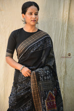 Load image into Gallery viewer, Close-up of fish motif border on Krishnakali black Sambalpuri Bandha cotton saree — Bhulia handloom, Pasapali