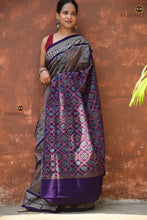 Load image into Gallery viewer, Handloom drape view of Kusumalata Sambalpuri cotton saree in grey — Bhulia woven double ikat with rust and blue accents