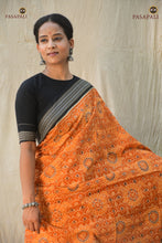 Load image into Gallery viewer, Kusumita Sambalpuri cotton saree folded flat — mustard yellow and black Bandha weave, Pasapali handloom
