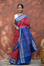 Load image into Gallery viewer, Kusumita GI certified Sambalpuri handloom saree — folded view highlighting red and blue colour contrast