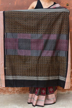 Load image into Gallery viewer, Lopamudra — folded saree showing maroon and black palette of Sambalpuri Bandha cotton saree by Pasapali