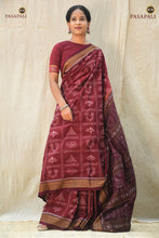 Load image into Gallery viewer, Mahalakshmi maroon Sambalpuri cotton saree folded — Bandha ikat motifs visible across warp and weft