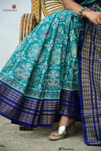 Load image into Gallery viewer, Folded view of Neelambari teal green Sambalpuri Bandha saree — GI certified Sambalpuri handloom, Pasapali