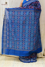 Load image into Gallery viewer, Neelima navy blue Sambalpuri handloom cotton saree folded to show Rudraksha border and flower pallu edge