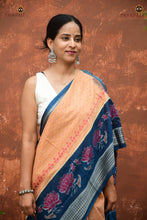Load image into Gallery viewer, Padmavati Cream Sambalpuri Bandha mercerized cotton saree by Pasapali — full hero view with teal blue border and lotus body