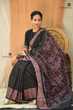 Load image into Gallery viewer, Purvasha authentic Sambalpuri handloom saree draped — black double ikat cotton, Daanti body, Pasapali