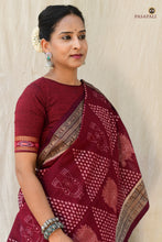 Load image into Gallery viewer, Ramā Goddess Laxmi Inspired maroon Sambalpuri cotton saree by Pasapali — full view, Bandha double ikat, Lakshmi and lotus motifs