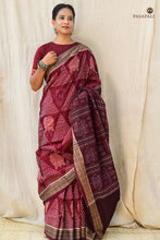 Load image into Gallery viewer, Body weave detail of Ramā maroon Sambalpuri Bandha saree — lotus and jhoti motifs in 120x120 thread count mercerized cotton