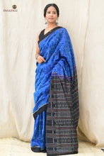 Load image into Gallery viewer, Front drape view of Shankhamayi Blue Sambalpuri cotton saree showing all-over shankha motifs and solid black border