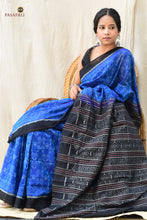Load image into Gallery viewer, Folded view of Shankhamayi Blue Sambalpuri Bandha mercerized cotton saree showing warp-weft ikat alignment