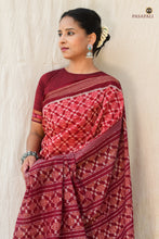 Load image into Gallery viewer, Vasumati Maroon Sambalpuri Bandha saree by Pasapali — folded saree showing Rudraksha border and pallu
