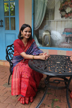 Load image into Gallery viewer, Handloom blue saree featuring vibrant jhoti motifs and a traditional rudraksh design on the border
