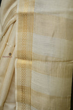 Load image into Gallery viewer, Folded natural tussar Sambalpuri silk saree by Pasapali showing layered zari border and striped pallu at fold edge.
