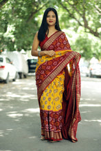 Load image into Gallery viewer, Odisha handloom saree with Tree of Life buttas, Phula Ikat body, and golden woven border – Pasapali
