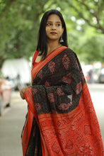 Load image into Gallery viewer, cotton Sambalpuri saree in dark brown with green floral buds and red flowers
