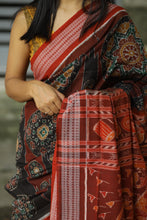 Load image into Gallery viewer, Rāgini – Black &amp; Rust Mercerized Cotton Sambalpuri Saree with Musical Ikat Motifs
