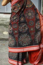 Load image into Gallery viewer, Rāgini – Black &amp; Rust Mercerized Cotton Sambalpuri Saree with Musical Ikat Motifs
