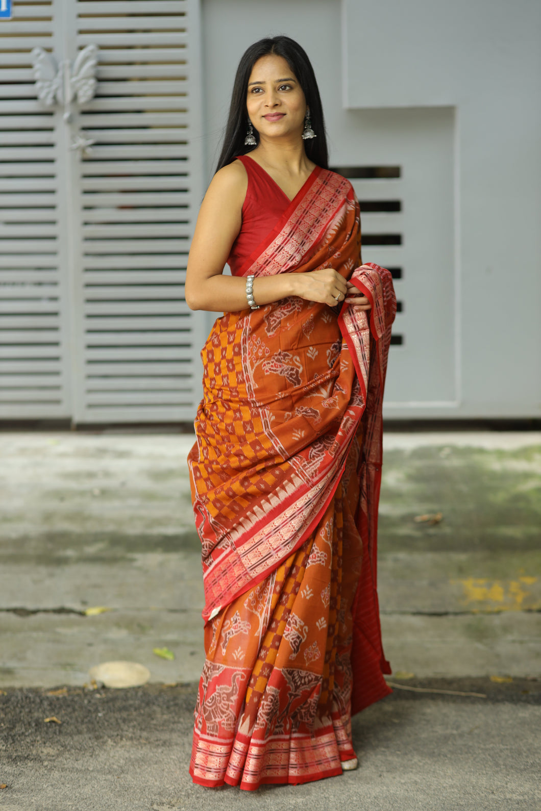 Light brown Sambalpuri cotton saree with elephant, lion, and fish Ikat motifs in the border – Pasapali