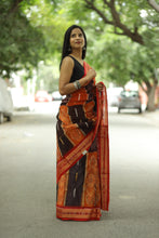 Load image into Gallery viewer, Floral Ikat Sambalpuri saree featuring vibrant orange and black hues with red pallu by Pasapali
