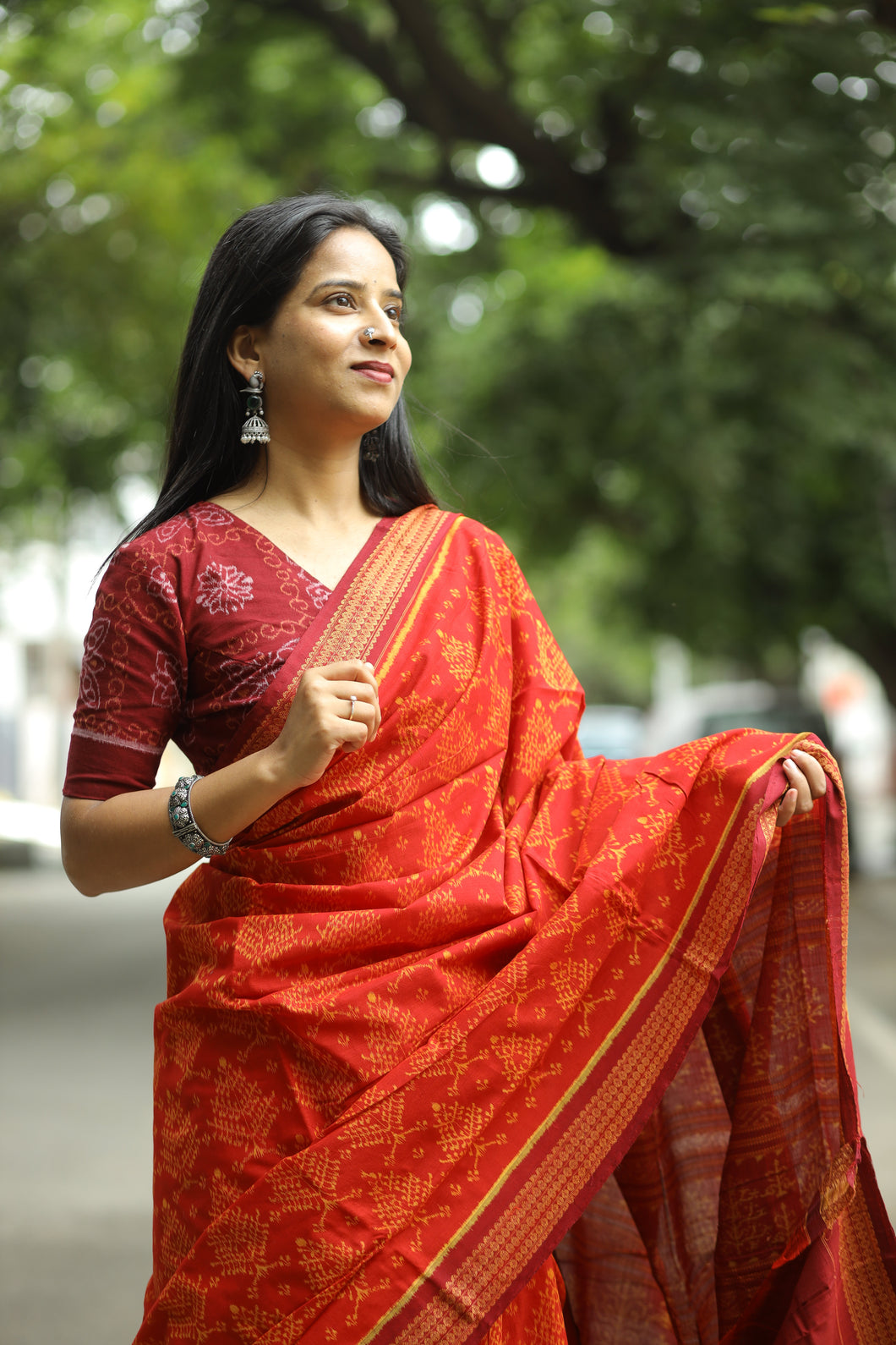 Bright red cotton saree with maroon border and classic Rudraksha motif detailing by Pasapali