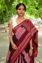 Load image into Gallery viewer, Close-up of maroon Rudraksha border on black Sambalpuri double ikat saree handwoven by Bhulia weavers, Odisha — Pasapali.
