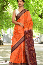 Load image into Gallery viewer, Full view of orange Sambalpuri mercerized cotton saree by Pasapali with Phula motif body and deep maroon Rudraksha border.
