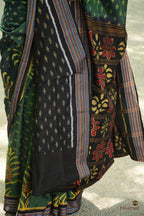Weave detail of striped buta and large yellow flower on deep green double ikat Sambalpuri cotton saree, Pasapali.