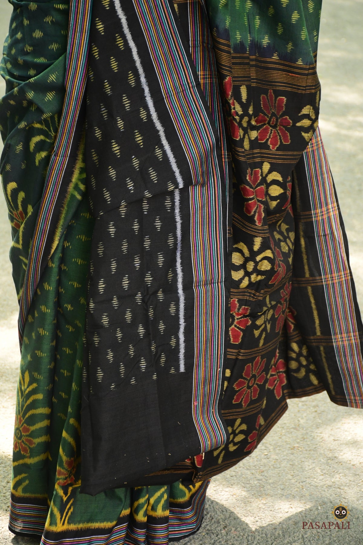 Weave detail of striped buta and large yellow flower on deep green double ikat Sambalpuri cotton saree, Pasapali.