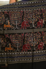 Load image into Gallery viewer, Front drape of Night Blue Sambalpuri Bandha saree by Pasapali — peacock motif body and black fish border visible in natural light.
