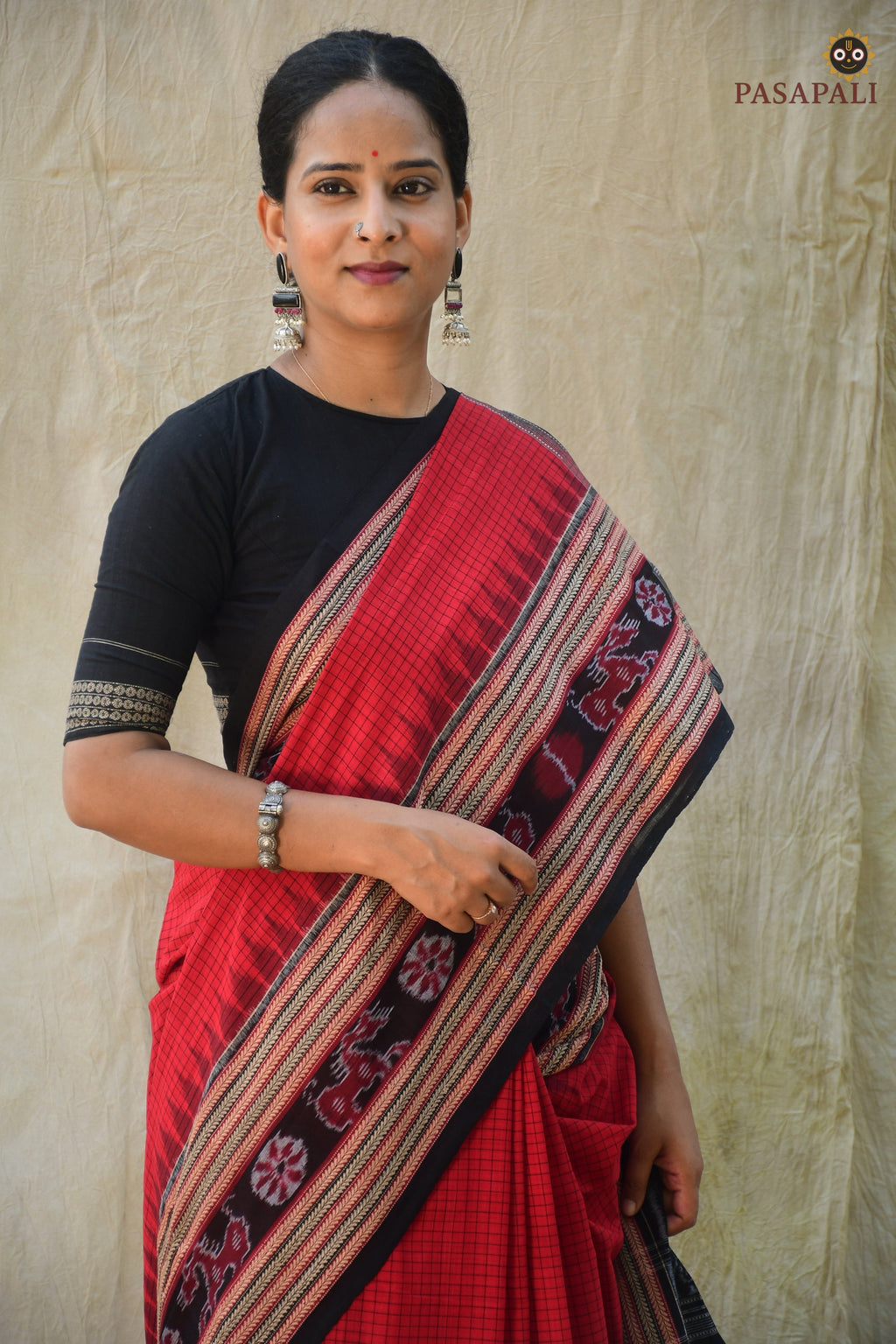 Close-up of Sachipar ikat weave — Red Sambalpuri mercerized cotton handloom saree — Pasapali Odisha