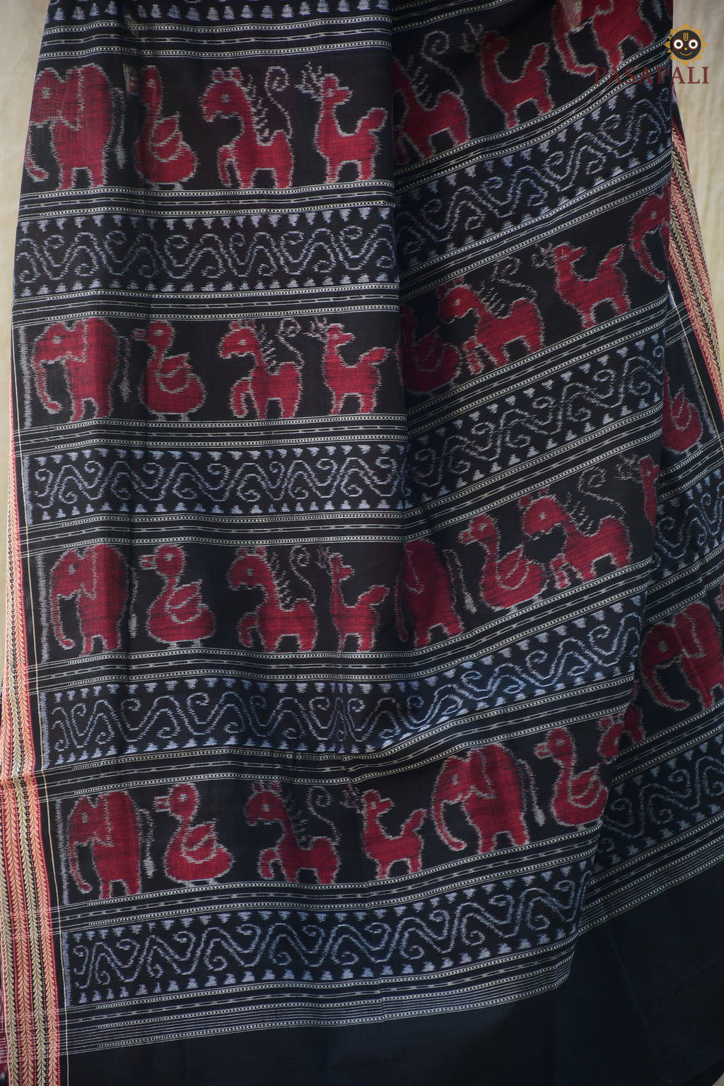 Close-up of Sachipar ikat weave — Red Sambalpuri mercerized cotton handloom saree — Pasapali