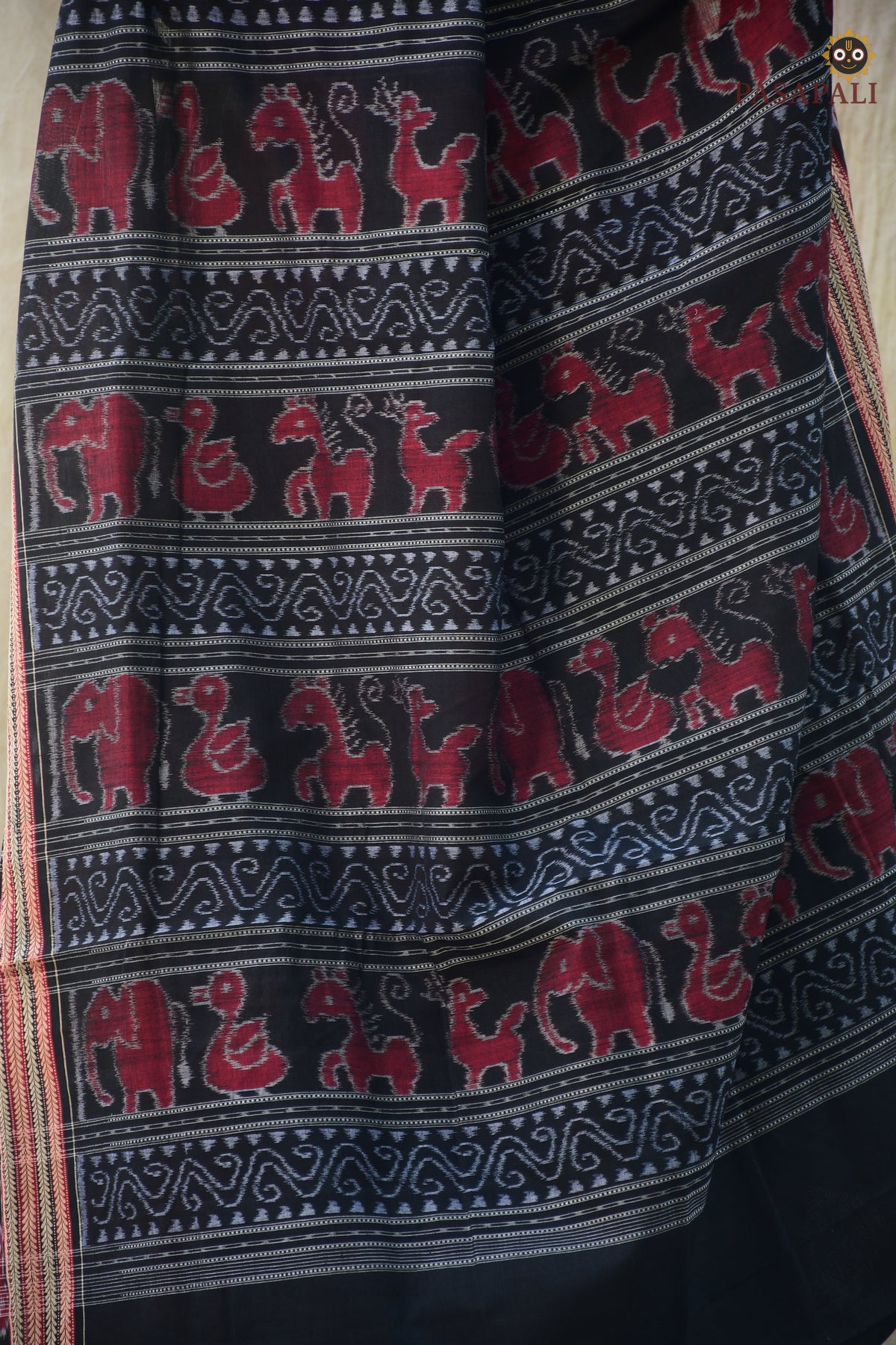 Close-up of Sachipar ikat weave — Red Sambalpuri mercerized cotton handloom saree — Pasapali
