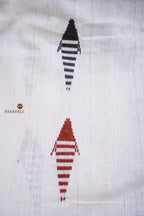 Aalraga GI certified Kotpad textile saree — hero full view showing off-white body and brown tribal weave, Pasapali