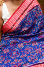 Akshaya Blue Sambalpuri Bandha saree front drape — lotus pallu, fish border, flower chakra body by Pasapali