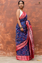 Body weave detail of Akshaya showing jhoti and flower chakra motifs in blue and red Sambalpuri Bandha cotton