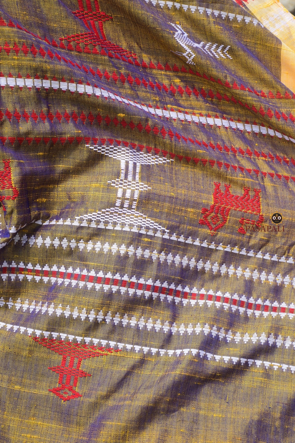 Flat lay of Amalaki golden Kotpad Tussar Cotton Silk saree — red kumbha border, tribal body motifs, Pasapali