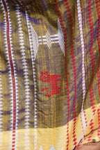 Amalaki Kotpad handloom saree overhead view — natural aal bark dyed golden silk cotton, Mirgan weavers, Odisha