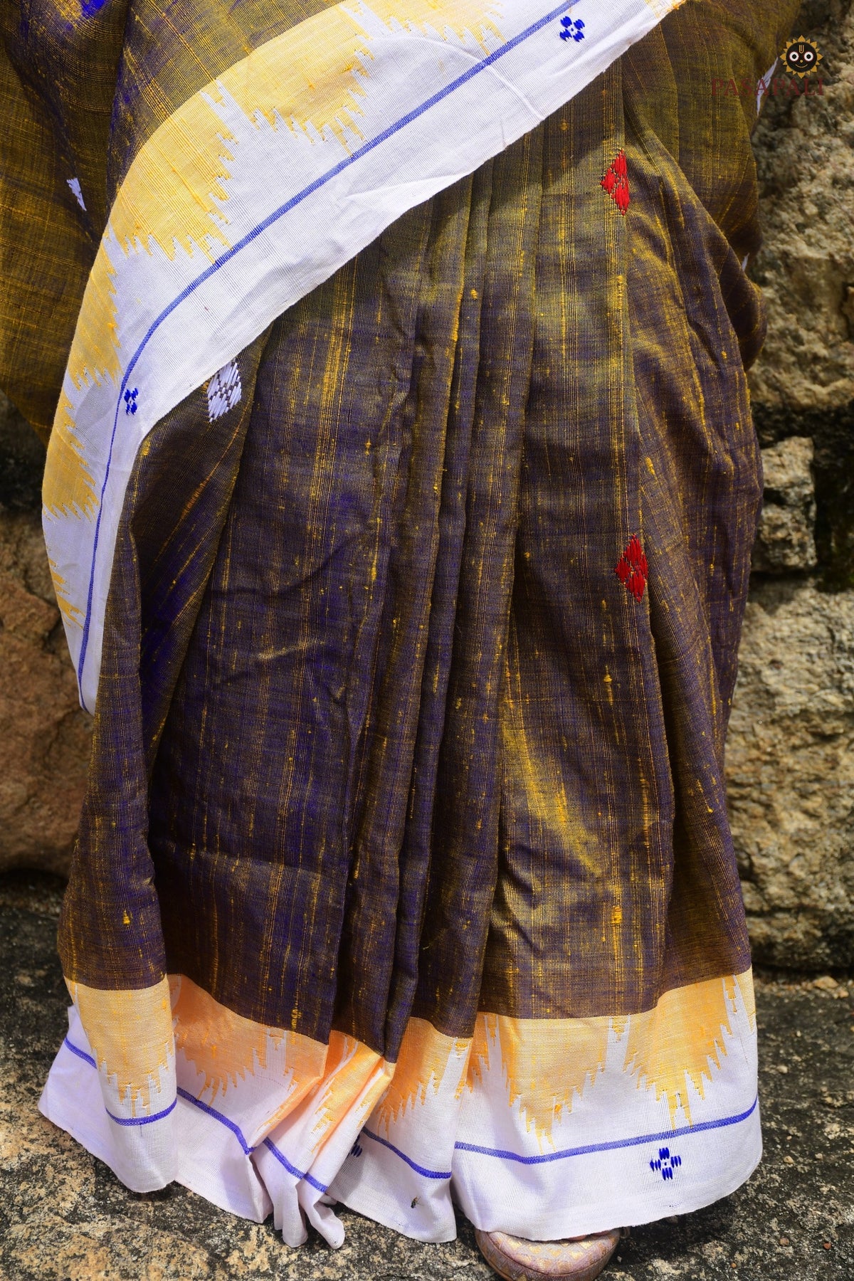 Amalaki pallu detail — macha fish and pharsa axe tribal motifs woven via extra-weft on golden Tussar Cotton Silk
