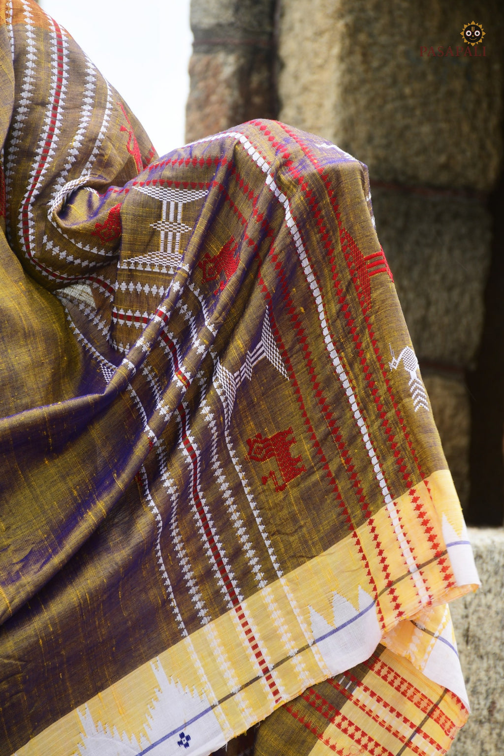 Handloom drape view of Amalaki — golden Kotpad natural dye saree with kumbha border by Mirgan tribal weavers