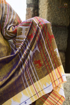 Handloom drape view of Amalaki — golden Kotpad natural dye saree with kumbha border by Mirgan tribal weavers