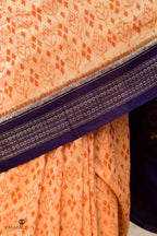 Anasuya Sambalpuri cotton saree by Pasapali — flat lay showing full length, Apricot Beige with Blue Bandha motifs.